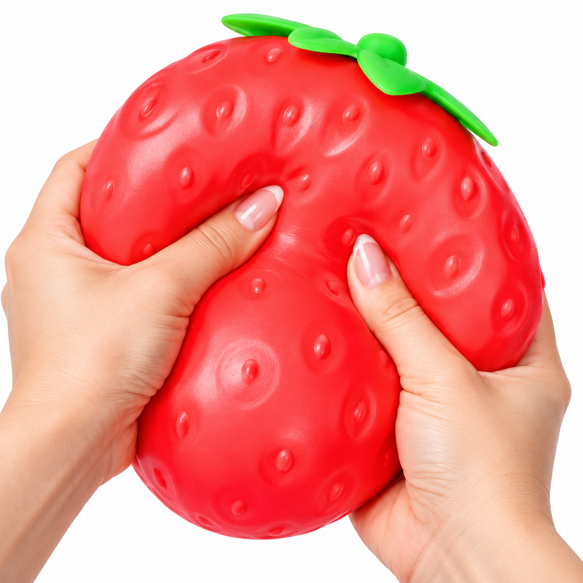 Two hands squeezing the giant strawberry squishy toy