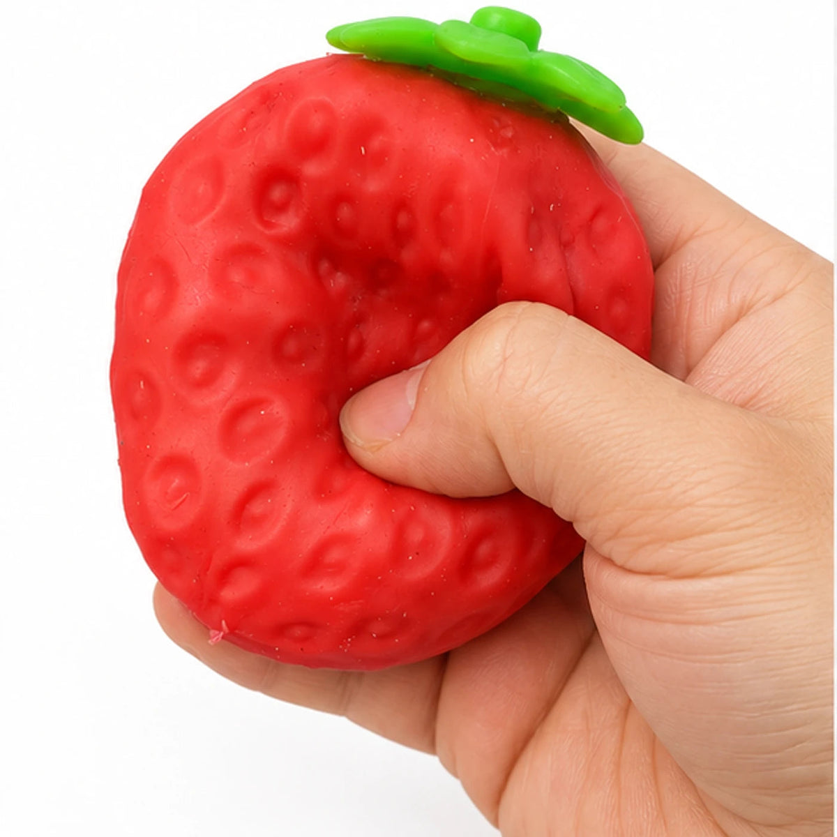 Crunchy strawberry squishy toy squeezed by hand