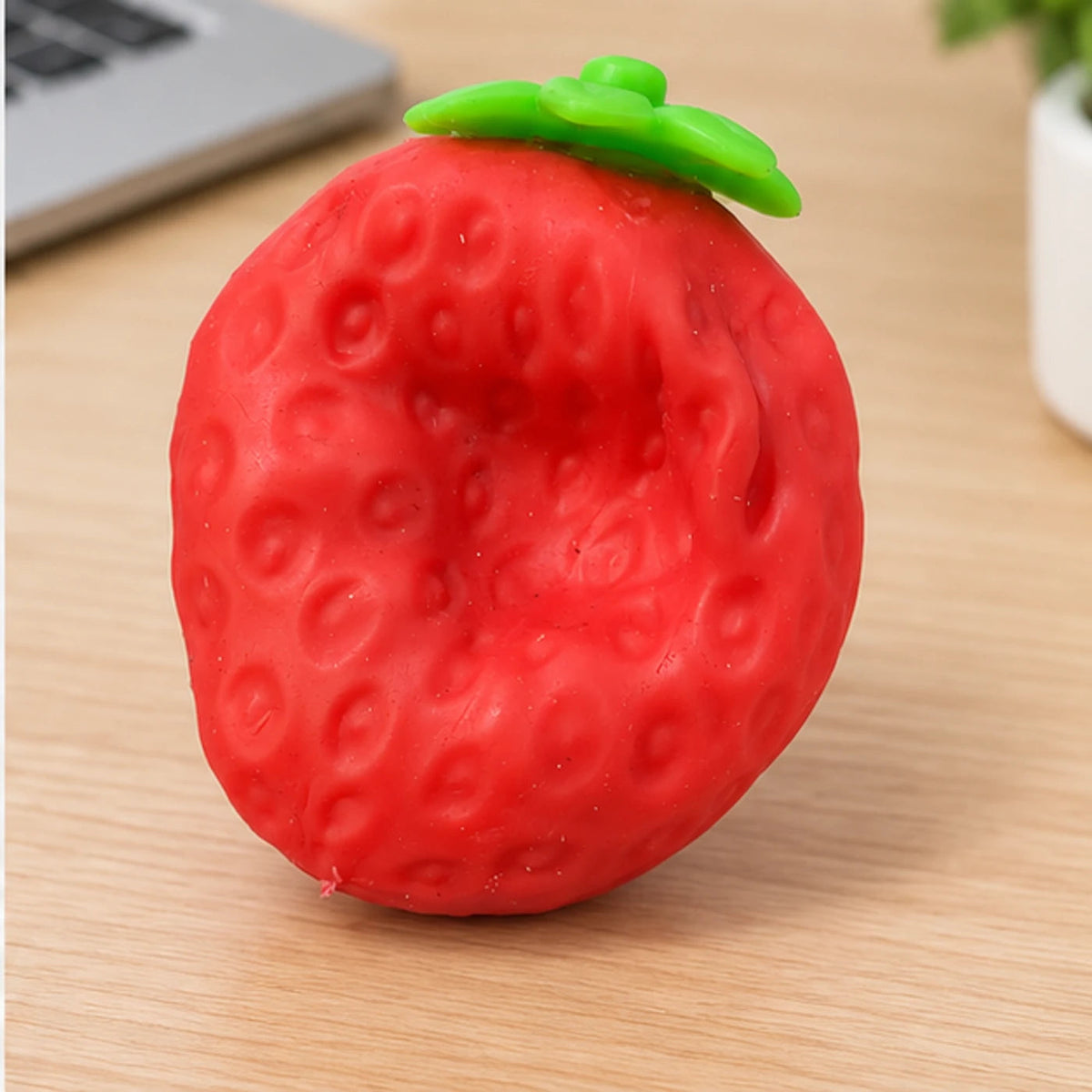 Crunchy strawberry squishy sensory toy lifestyle view