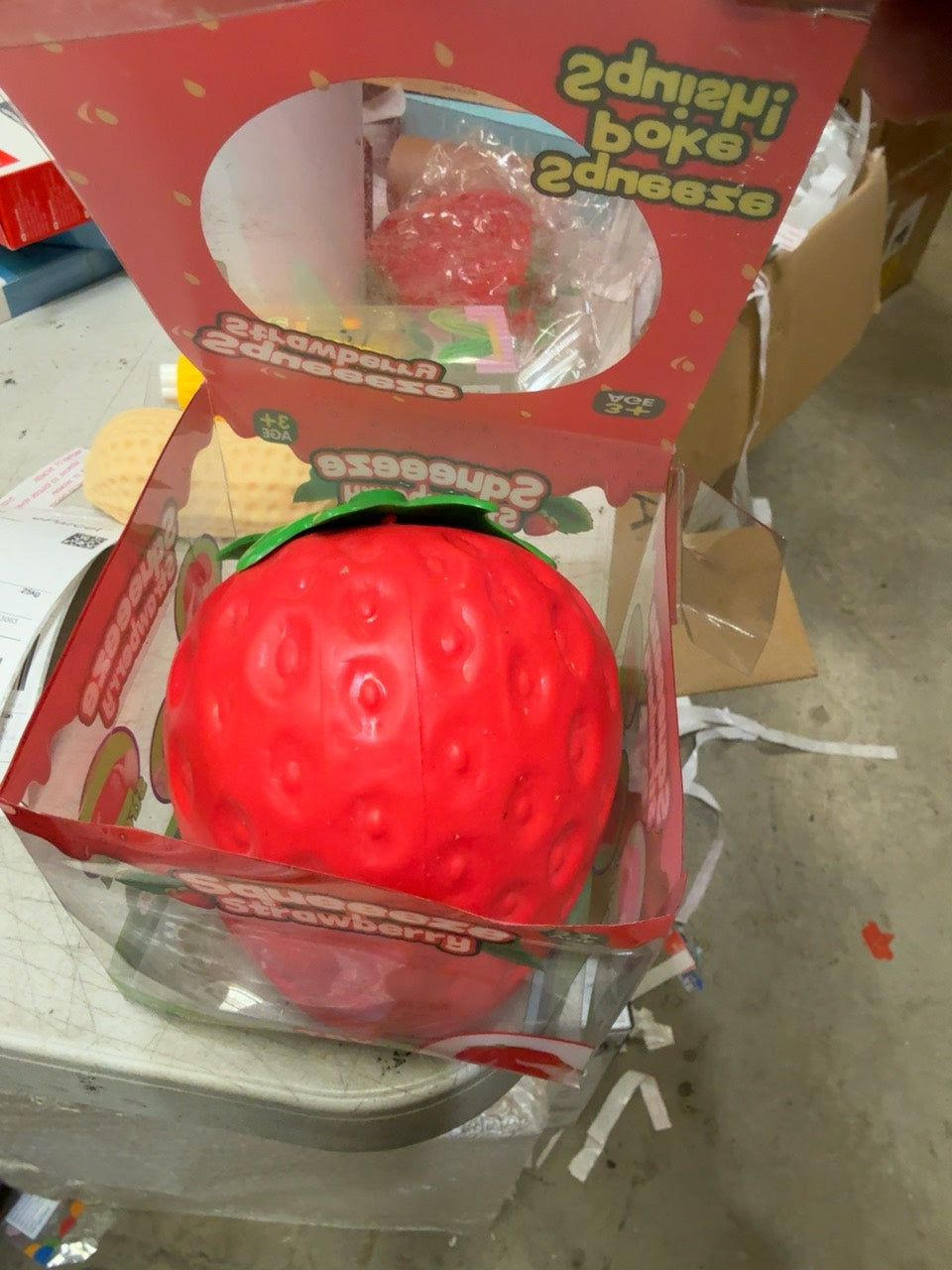 Boxed giant strawberry squishy photographed in stock